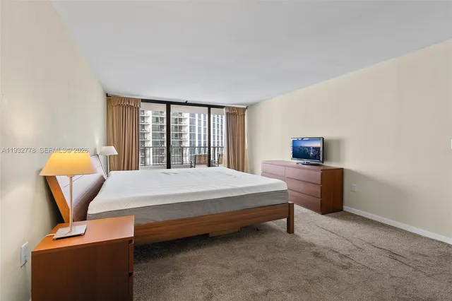 a bedroom with a bed and chair