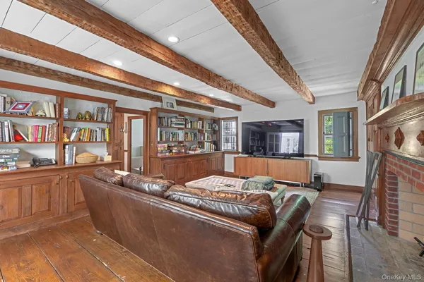 a living room with furniture and a floor to ceiling window or kitchen