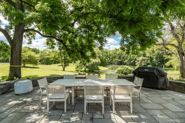 a view of a chairs and table in the patio