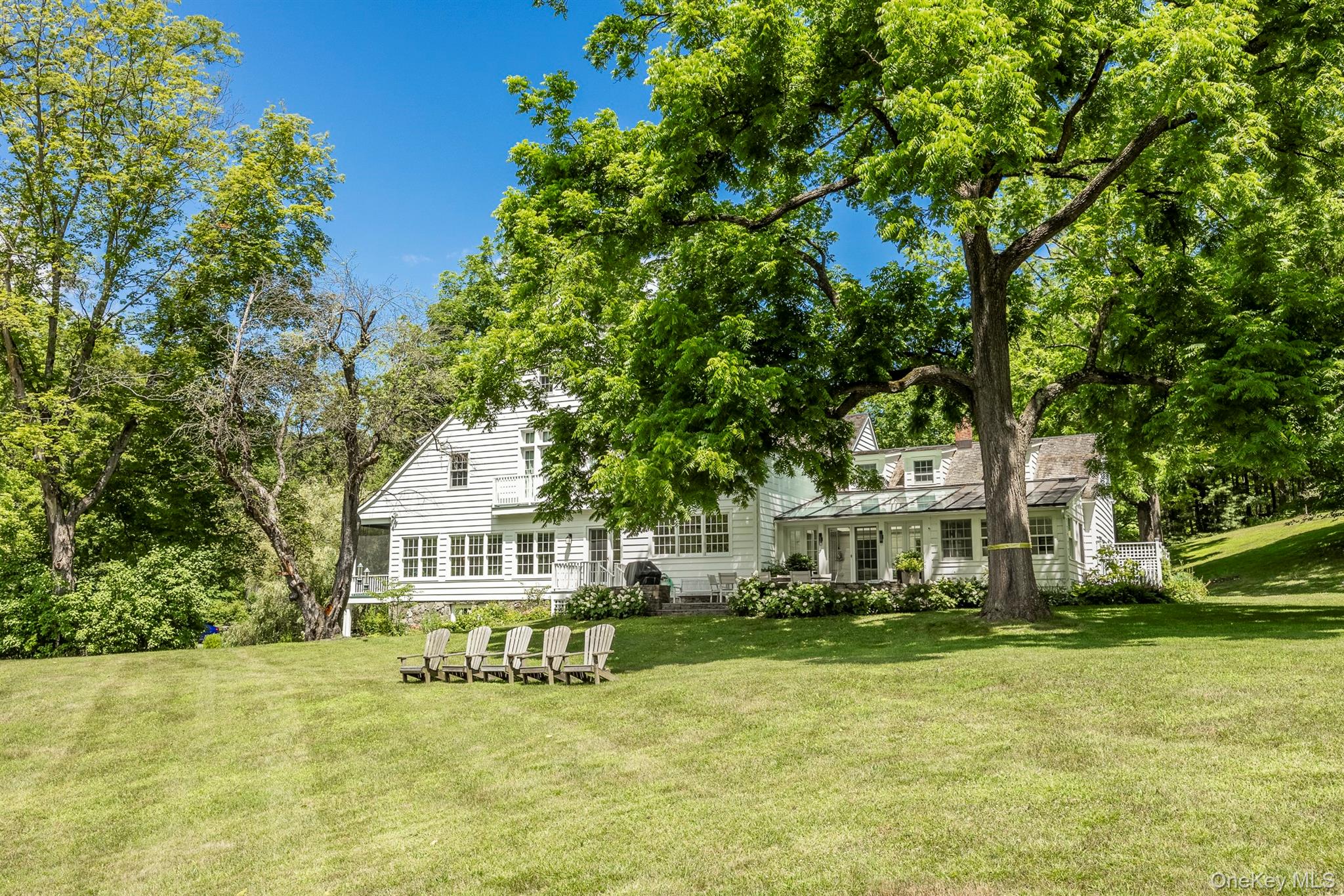 176 Schoolhouse Road Staatsburg, NY 12580 - Photo 2 of 37 a front view of a house with a garden