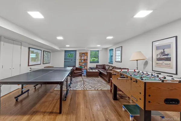 a living room with lots of furniture and wooden floor