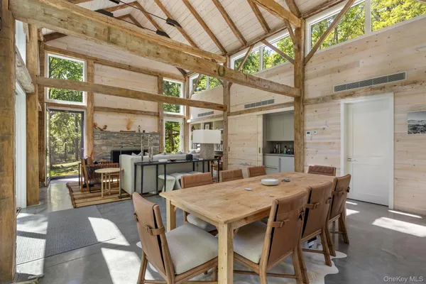a view of a dining room with furniture window and outside view