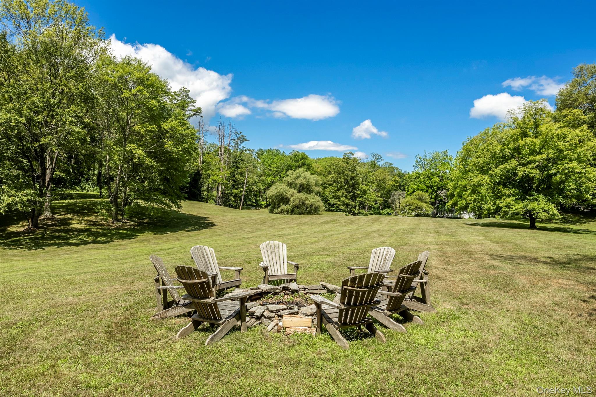 176 Schoolhouse Road Staatsburg, NY 12580 - Photo 35 of 37 a view of a lake with table and chairs