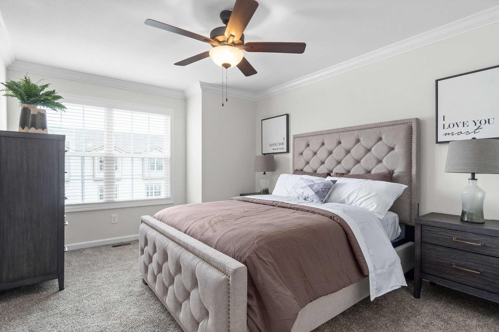 3350 Allen Road, Unit 14L Clarksville, TN 37042 - Photo 19 of 28 a bedroom with a large bed and a chandelier