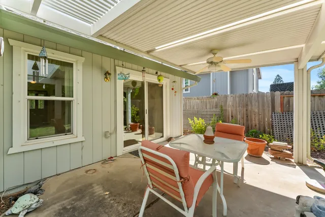 a outdoor space with patio the couches and a dining table with chairs