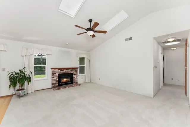 a view of a livingroom with furniture and a fireplace