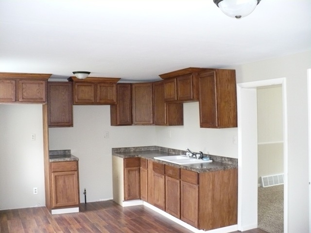 627 South 2nd Street Rochelle, IL 61068 - Photo 6 of 19 a kitchen with stainless steel appliances granite countertop a refrigerator and a stove