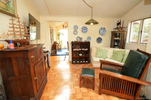 a kitchen with stainless steel appliances a sink a stove a refrigerator and cabinets