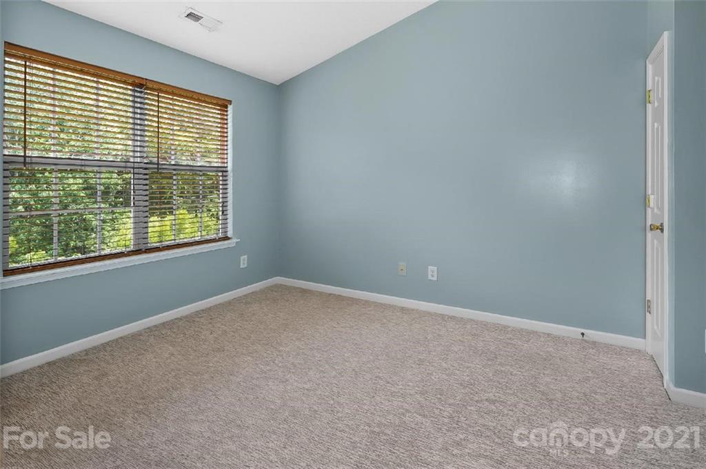 10930 Kinston Ridge Place, Unit 1237 Charlotte, NC 28273 - Photo 11 of 32 a view of an empty room with a window