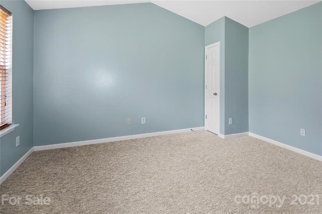 10930 Kinston Ridge Place, Unit 1237 Charlotte, NC 28273 - Photo 12 of 32 an empty room with windows