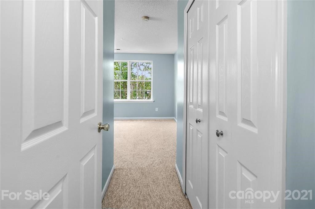 10930 Kinston Ridge Place, Unit 1237 Charlotte, NC 28273 - Photo 17 of 32 a bathroom with a granite countertop window and a shower