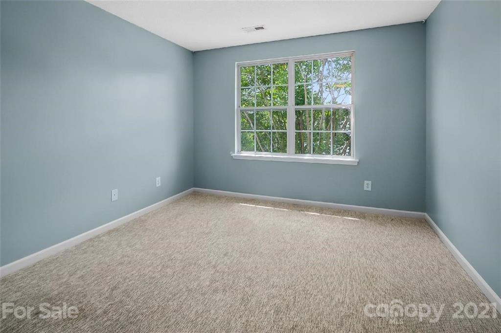 10930 Kinston Ridge Place, Unit 1237 Charlotte, NC 28273 - Photo 18 of 32 an empty room with a window