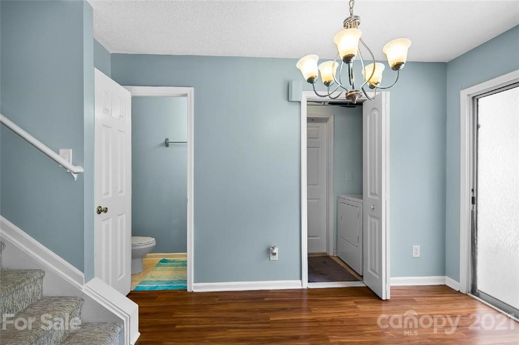 10930 Kinston Ridge Place, Unit 1237 Charlotte, NC 28273 - Photo 25 of 32 a view of a dining room with wooden floor