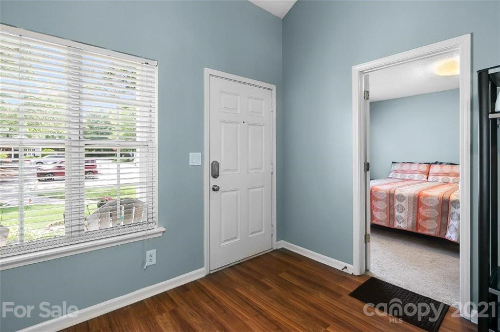 10930 Kinston Ridge Place, Unit 1237 Charlotte, NC 28273 - Photo 27 of 32 a bedroom with a bed and a window