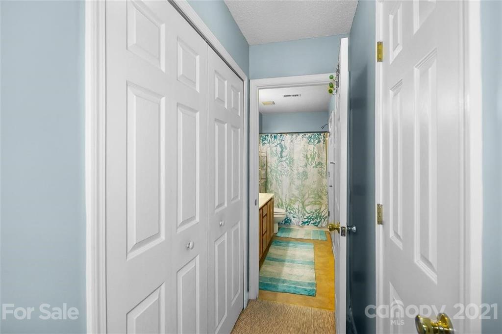 10930 Kinston Ridge Place, Unit 1237 Charlotte, NC 28273 - Photo 30 of 32 a view of a bathroom from the hallway