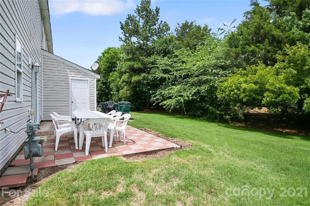 10930 Kinston Ridge Place, Unit 1237 Charlotte, NC 28273 - Photo 10 of 32 a view of a house with a backyard