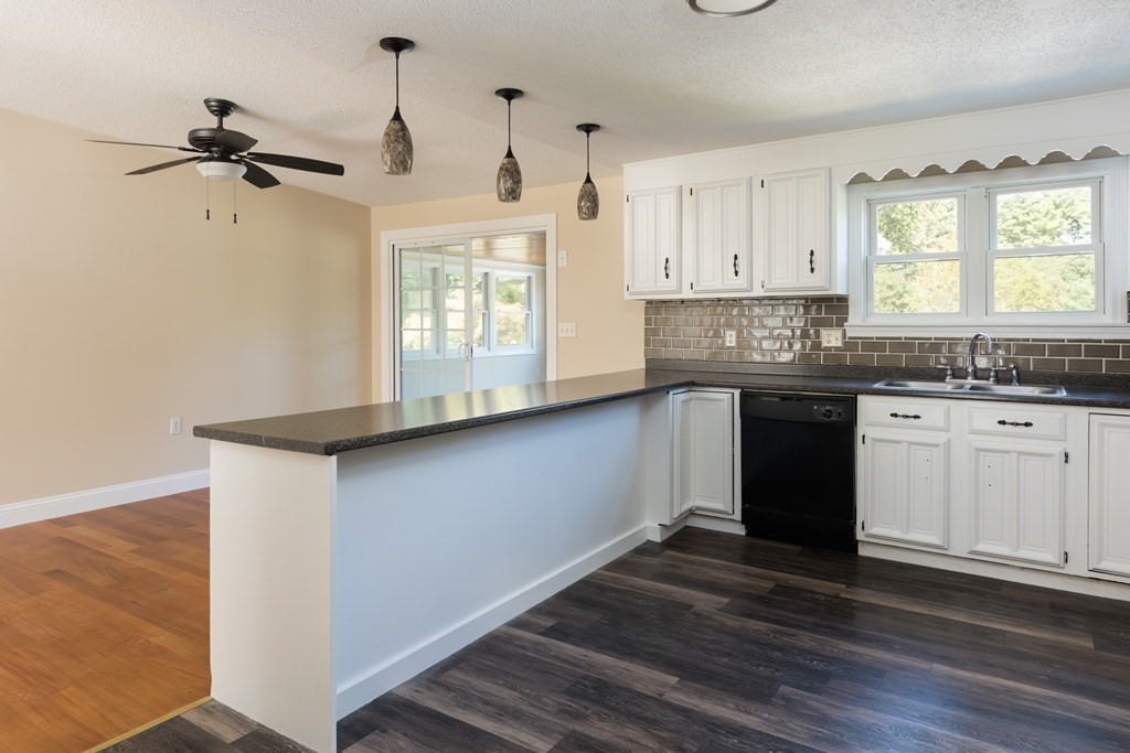 12 Gibbs Road Middleboro, MA 02346 - Photo 24 of 38 a kitchen with granite countertop a sink cabinets and wooden floor
