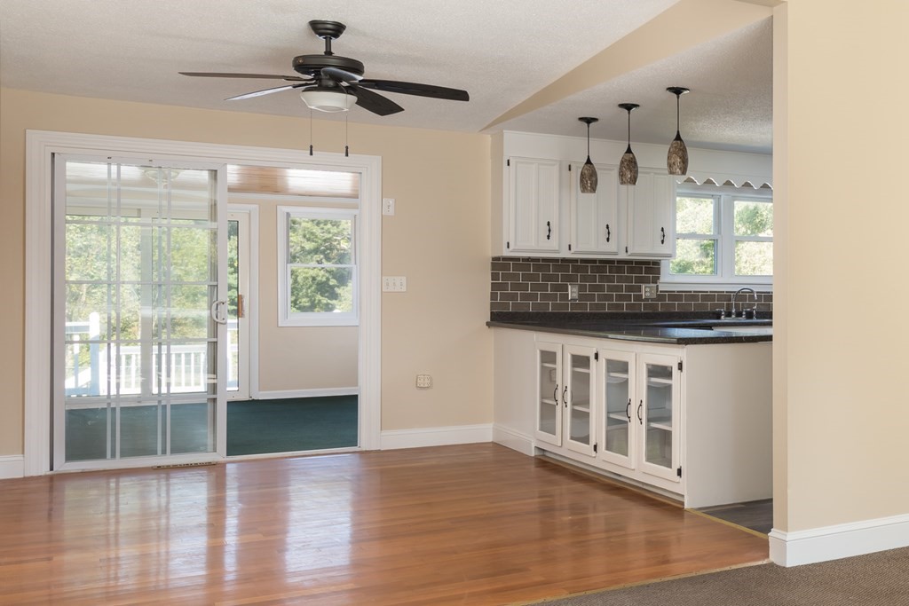 12 Gibbs Road Middleboro, MA 02346 - Photo 25 of 38 a view of an empty room with a window and wooden floor