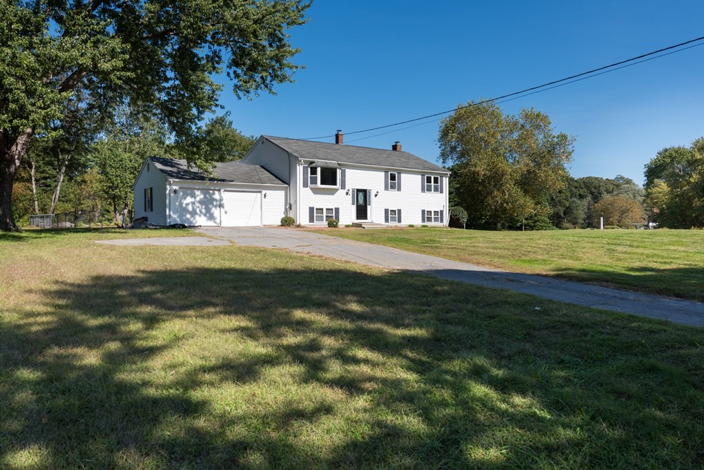12 Gibbs Road Middleboro, MA 02346 - Photo 4 of 38 a front view of a house with a yard