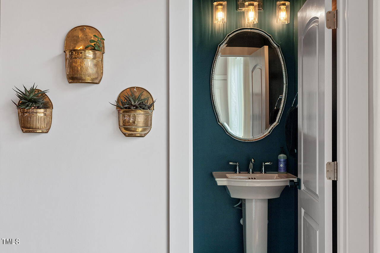 638 Watauga Street Raleigh, NC 27604 - Photo 18 of 41 a bathroom with a sink and a mirror
