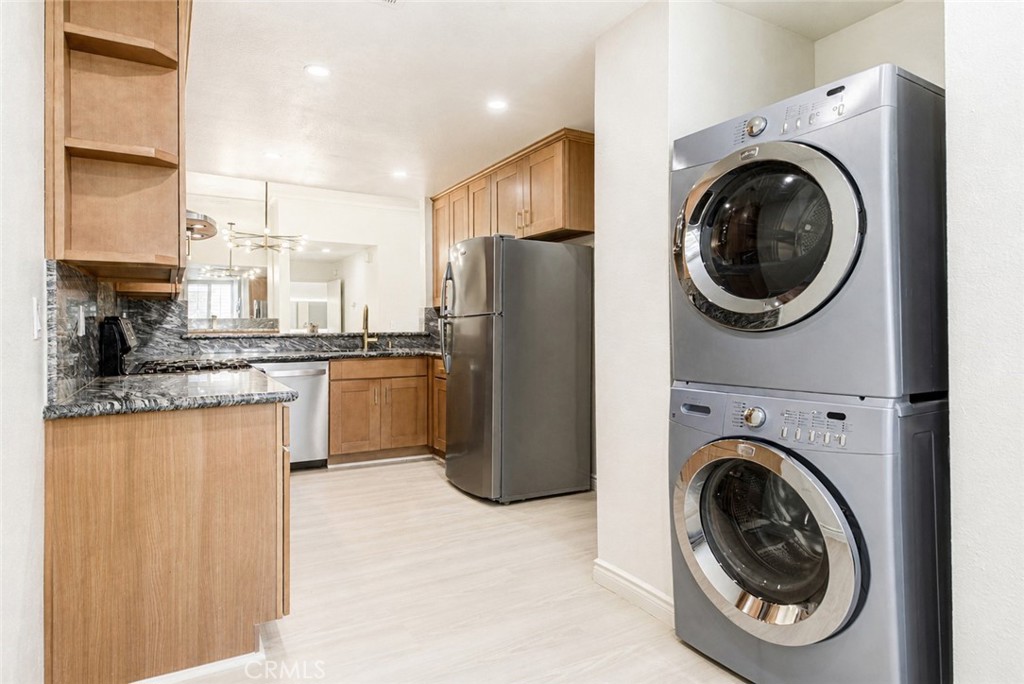 10470 Riverside Drive, Unit 102 Toluca Lake, CA 91602 - Photo 13 of 35 a kitchen with a washer and dryer