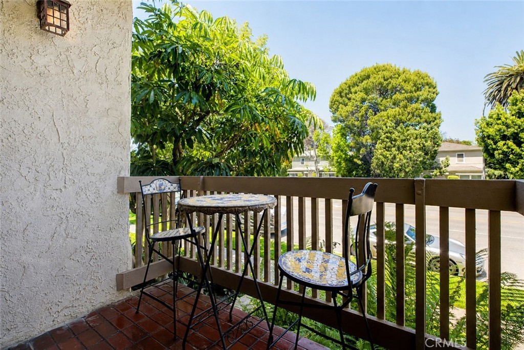 10470 Riverside Drive, Unit 102 Toluca Lake, CA 91602 - Photo 23 of 35 a view of a chair and table in the balcony