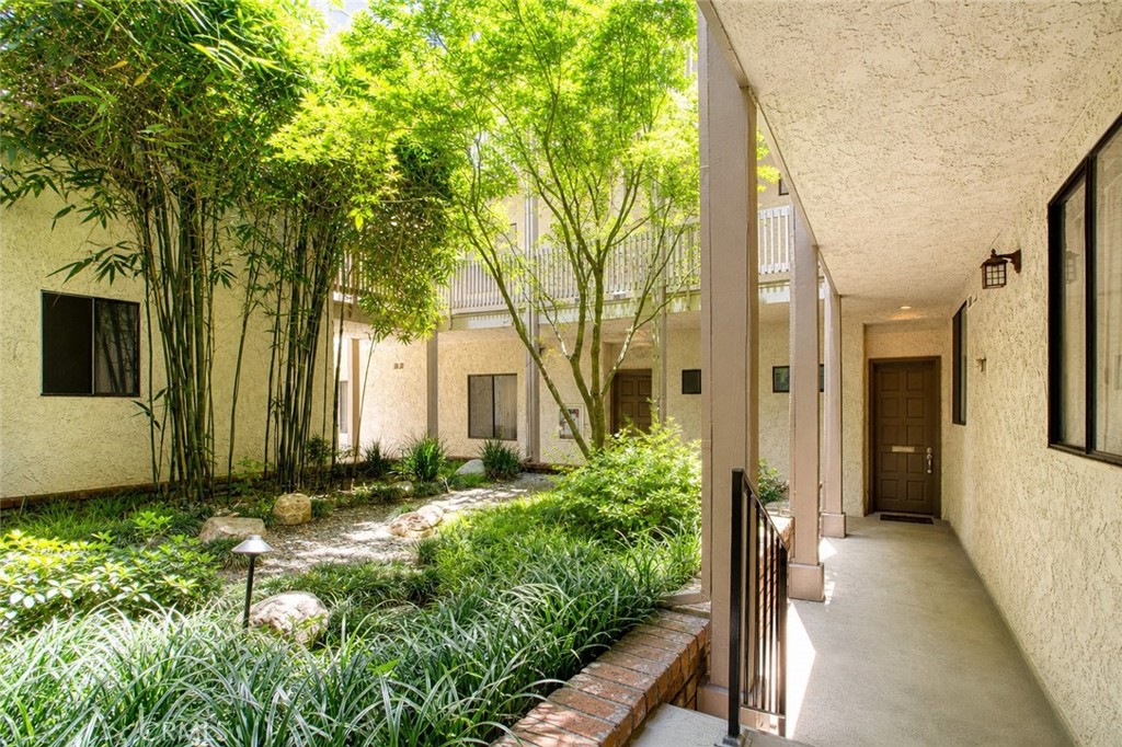 10470 Riverside Drive, Unit 102 Toluca Lake, CA 91602 - Photo 26 of 35 a view of a house with a backyard