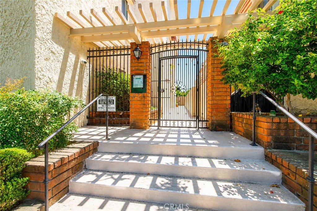 10470 Riverside Drive, Unit 102 Toluca Lake, CA 91602 - Photo 27 of 35 a view of front door of house with stairs