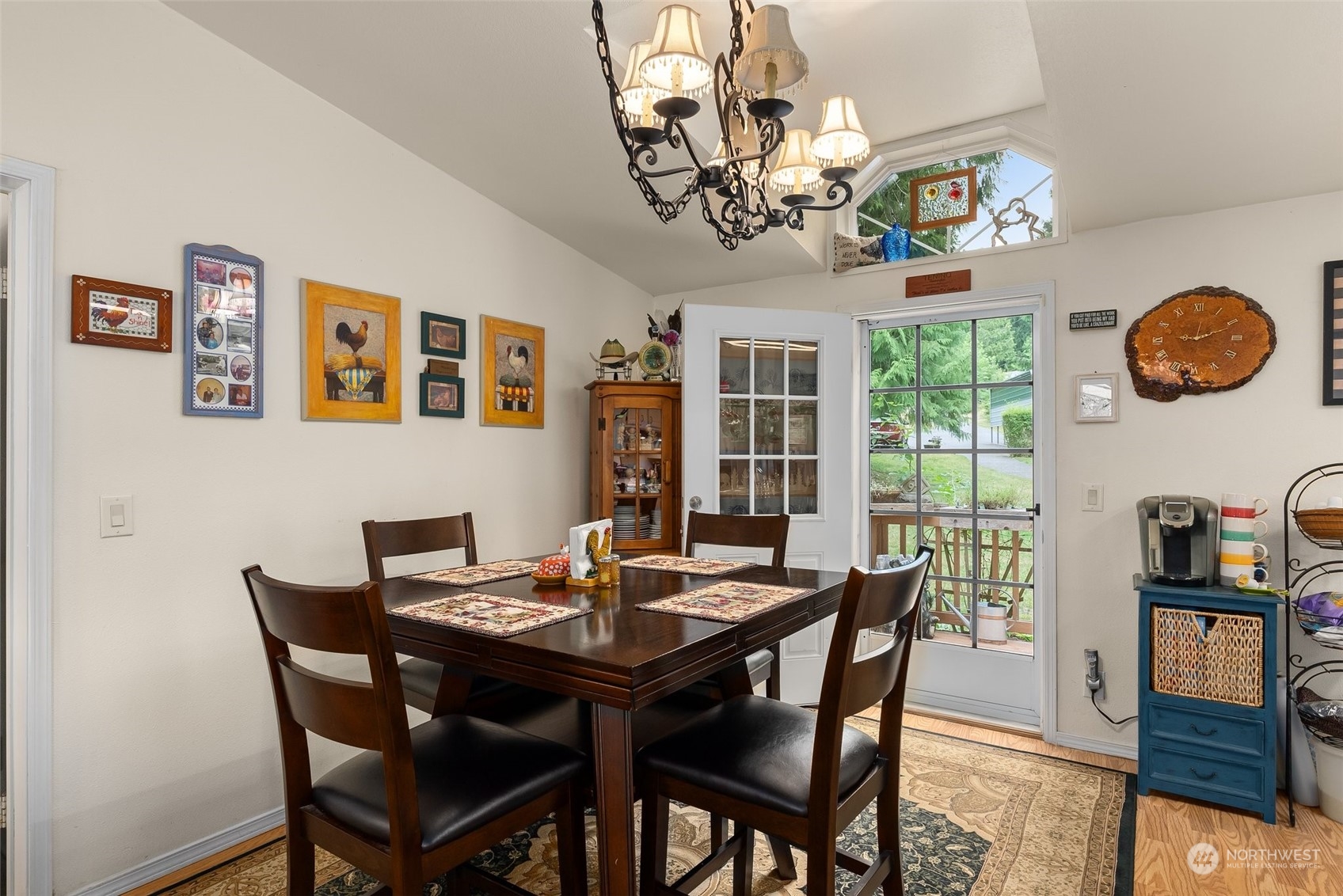 14940 Military Road Southeast Tenino, WA 98589 - Photo 11 of 30 a view of a dining room with furniture wooden floor and chandelier