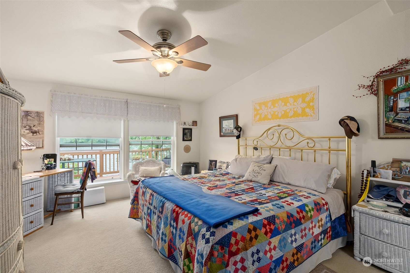 14940 Military Road Southeast Tenino, WA 98589 - Photo 13 of 30 a bedroom with a bed a large window and a chandelier