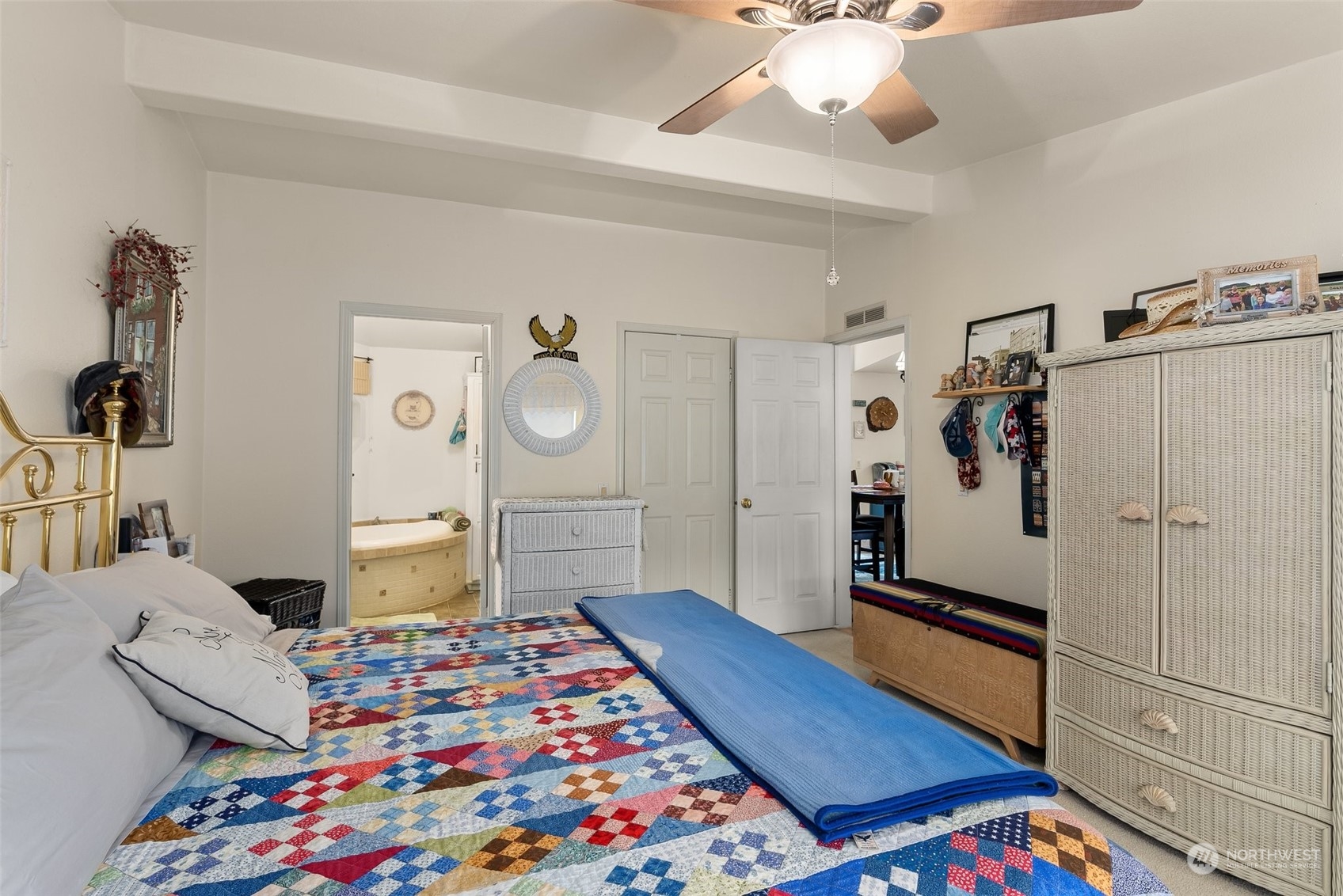 14940 Military Road Southeast Tenino, WA 98589 - Photo 14 of 30 a bedroom with filled bed and a chandelier