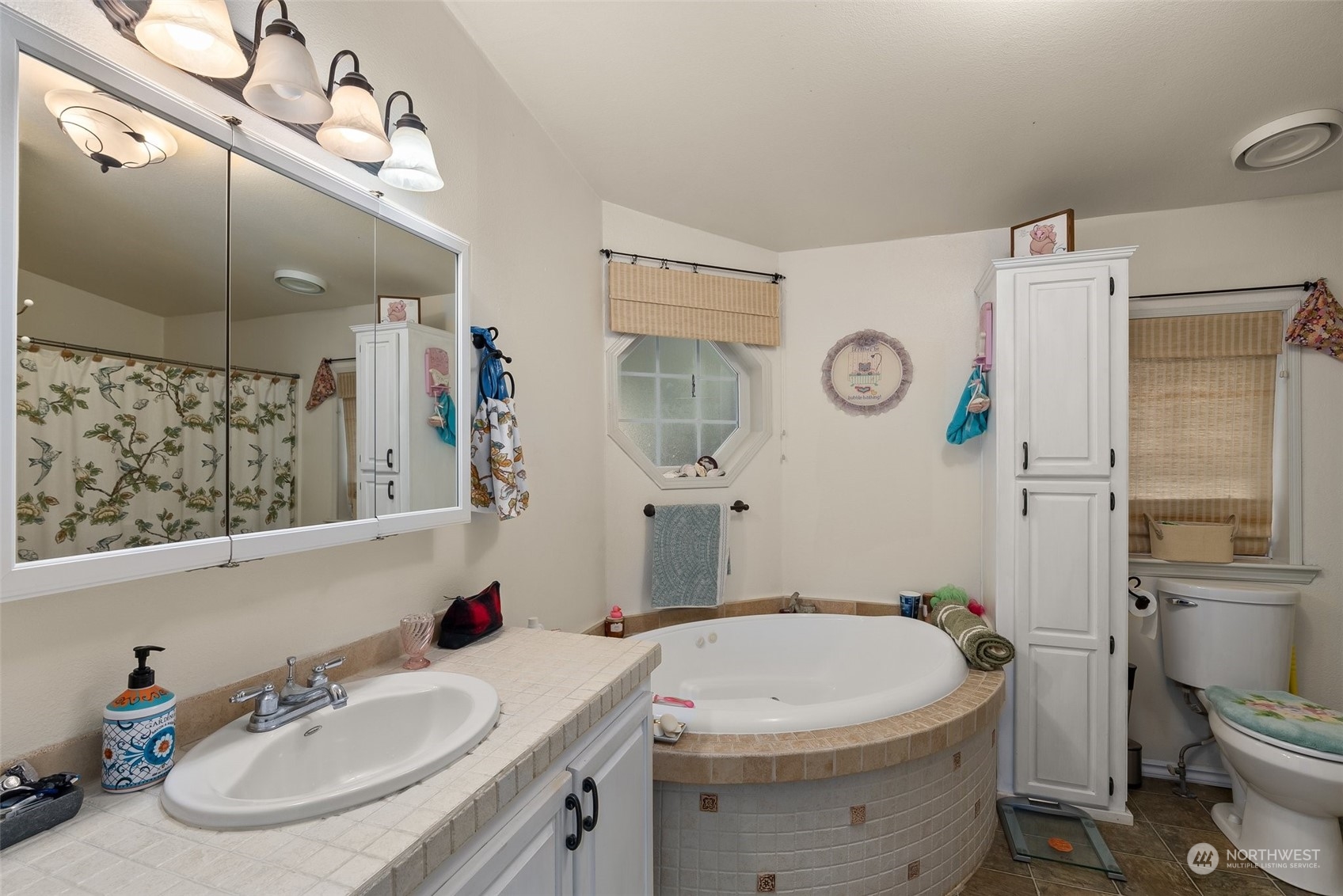 14940 Military Road Southeast Tenino, WA 98589 - Photo 15 of 30 a bathroom with a sink a toilet and shower