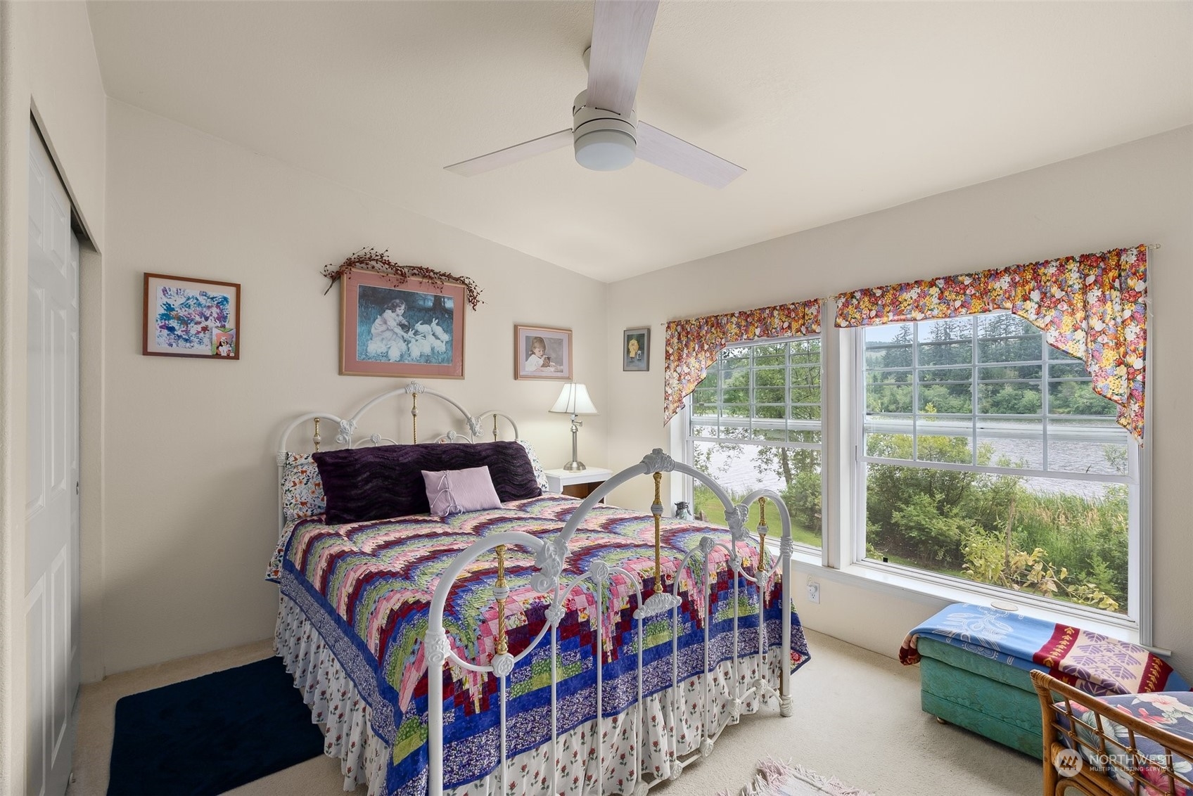 14940 Military Road Southeast Tenino, WA 98589 - Photo 16 of 30 a bedroom with a bed and a large window