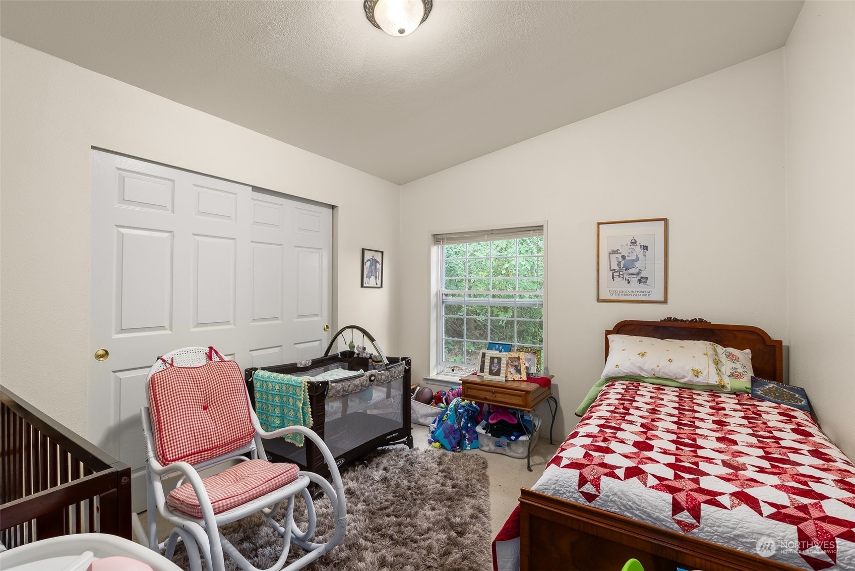 14940 Military Road Southeast Tenino, WA 98589 - Photo 17 of 30 a bedroom with a bed and chair