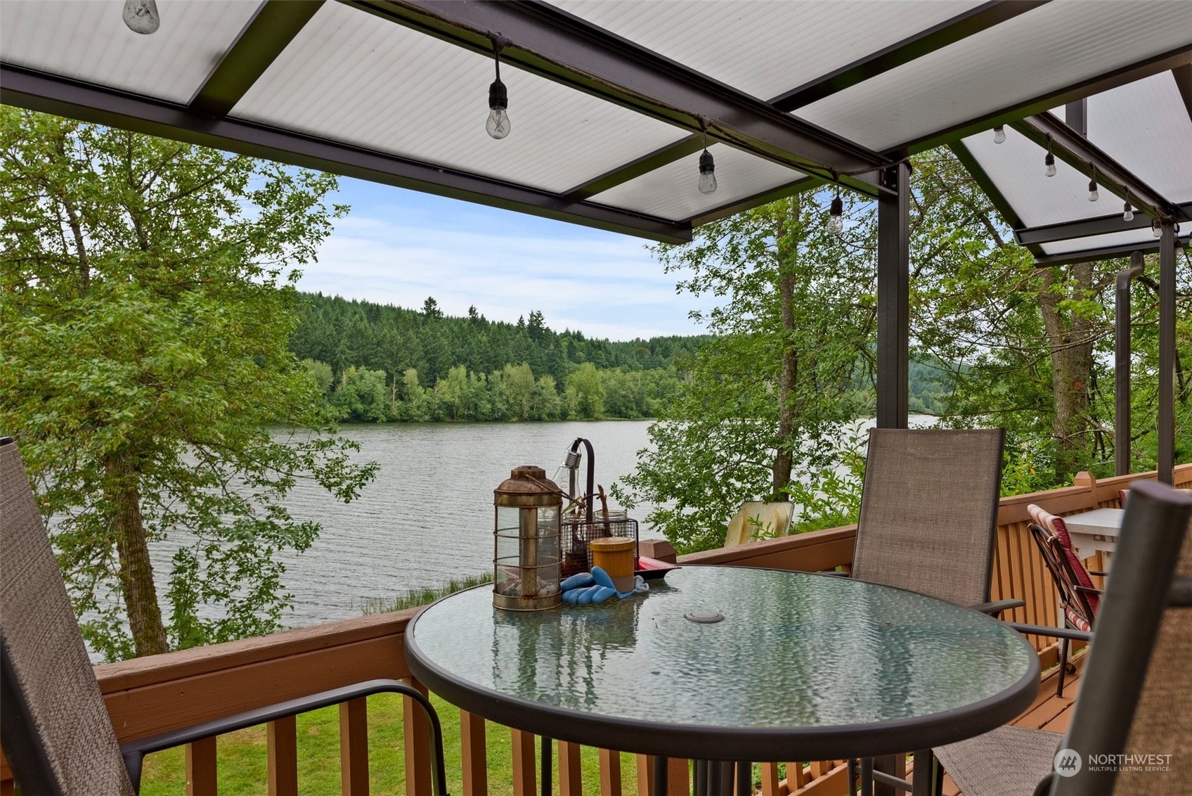 14940 Military Road Southeast Tenino, WA 98589 - Photo 20 of 30 a roof deck with table and chairs and wooden floor