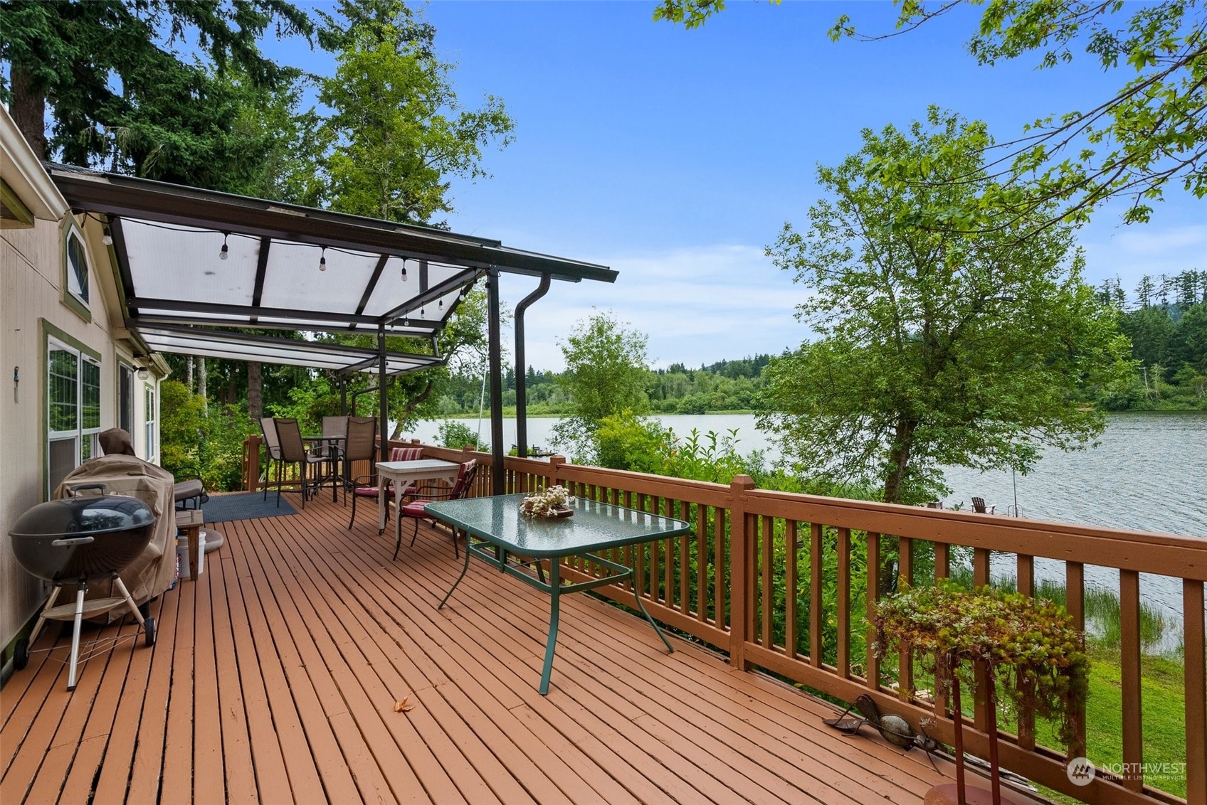 14940 Military Road Southeast Tenino, WA 98589 - Photo 21 of 30 a view of a balcony with chairs and wooden floor
