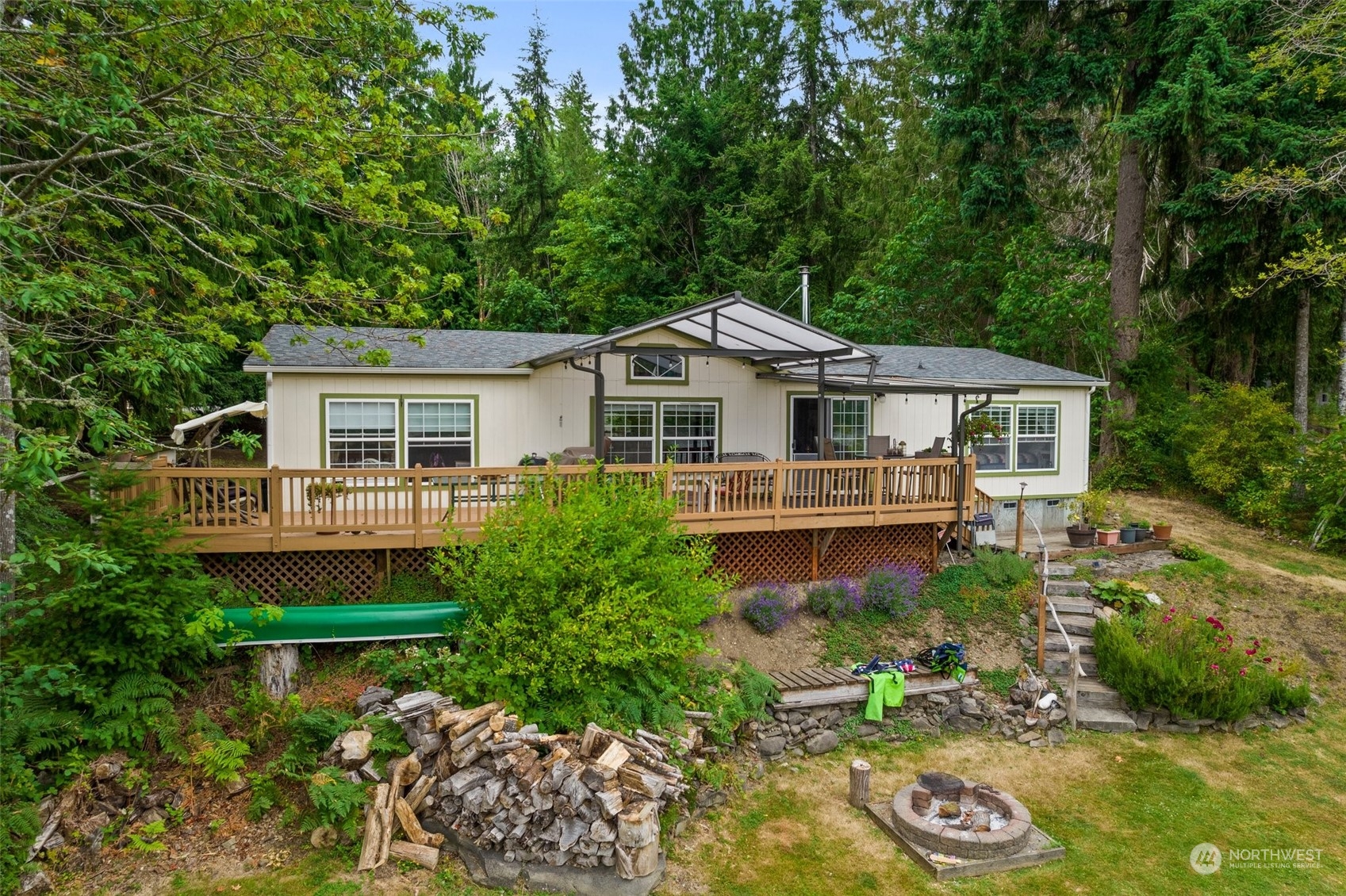 14940 Military Road Southeast Tenino, WA 98589 - Photo 29 of 30 a house with lots of trees in the background