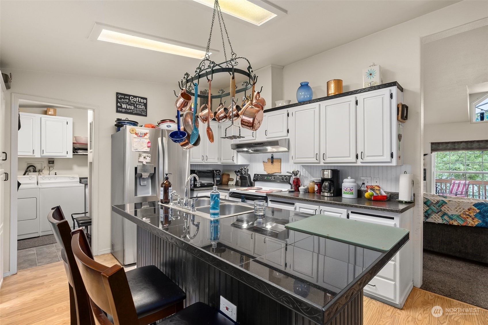 14940 Military Road Southeast Tenino, WA 98589 - Photo 10 of 30 a view of a dining room with furniture and a chandelier