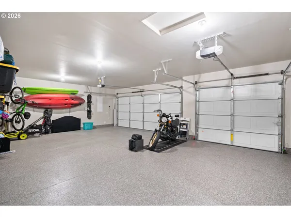 a view of a garage with a white car parked