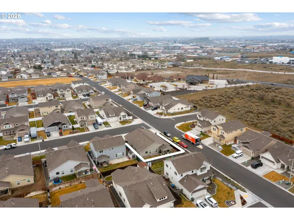 an aerial view of residential building and lake view