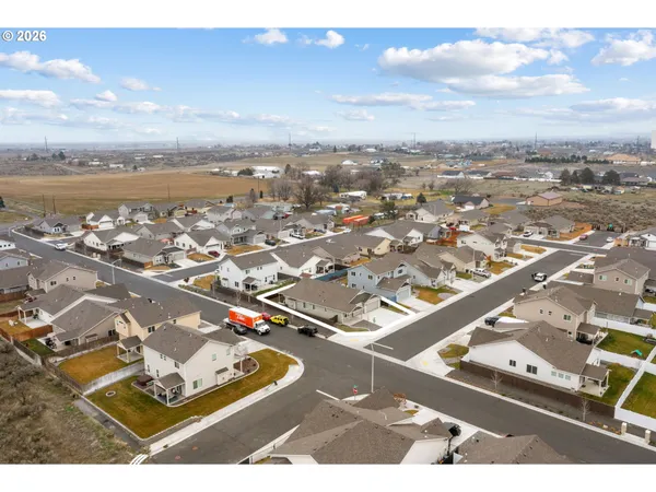 an aerial view of residential building and parking space