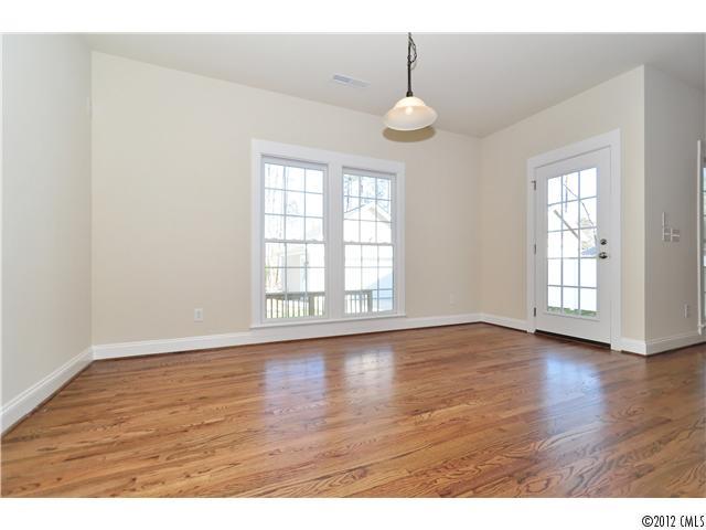 3426 Richard's Crossing Fort Mill, SC 29708 - Photo 11 of 16 an empty room with wooden floor and windows