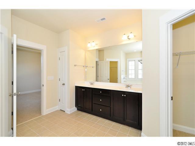 3426 Richard's Crossing Fort Mill, SC 29708 - Photo 14 of 16 a bathroom with a sink mirror and a shower