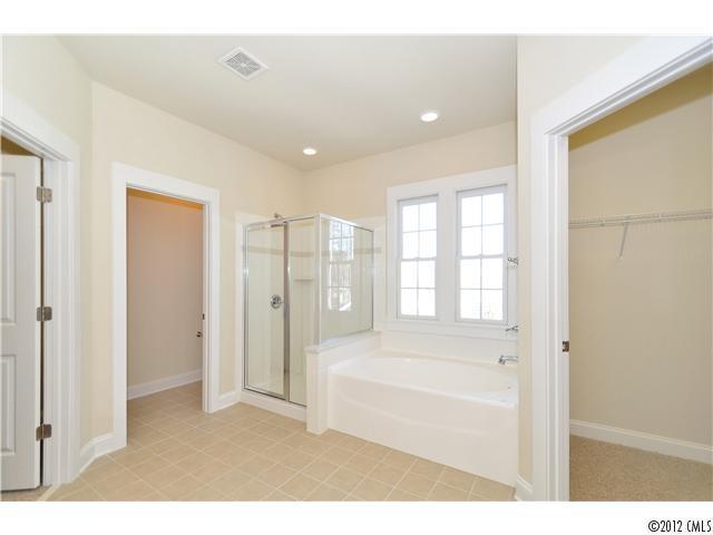 3426 Richard's Crossing Fort Mill, SC 29708 - Photo 15 of 16 a bathroom with a tub shower and a sink