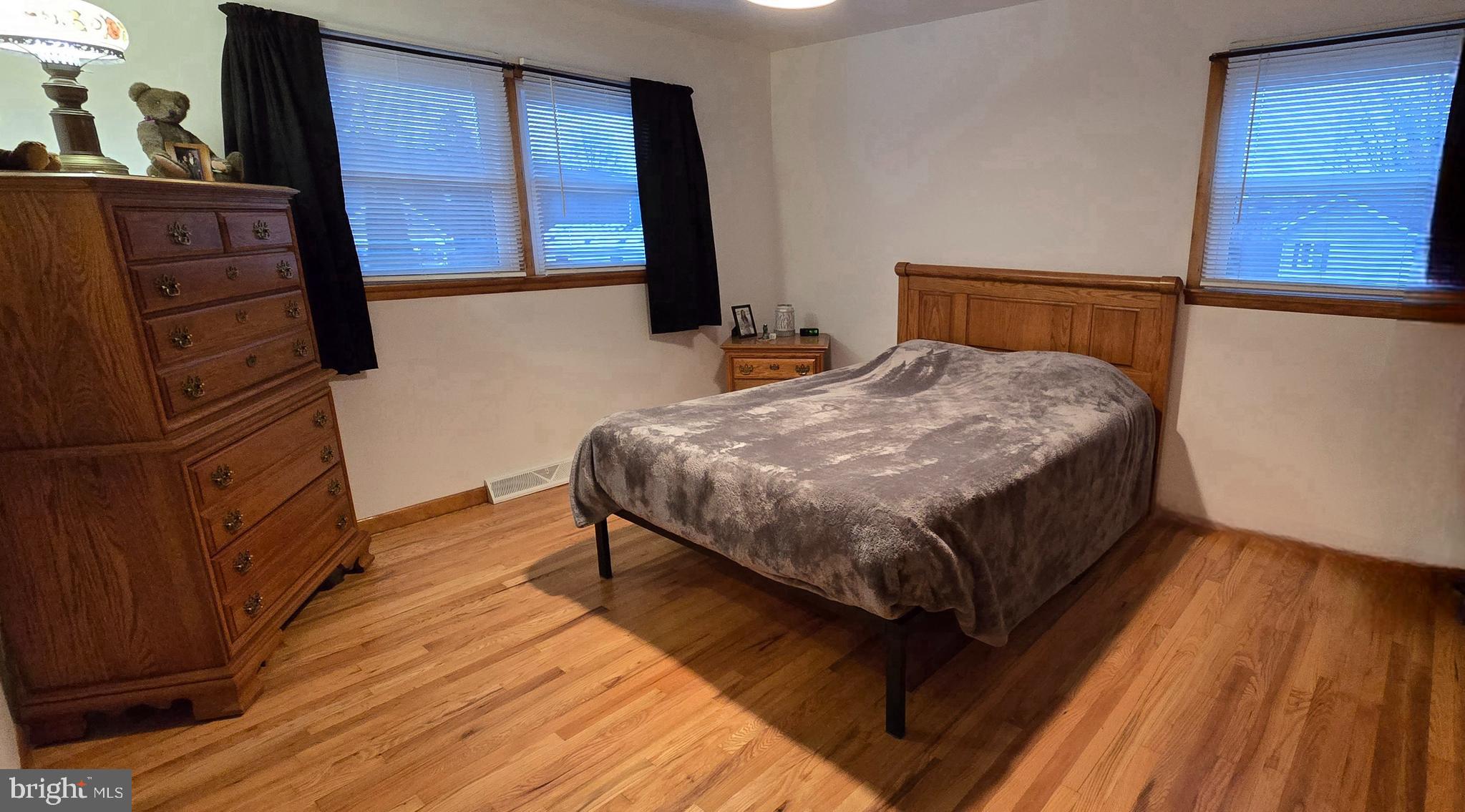 315 Long Lane Road Walnutport, PA 18088 - Photo 12 of 31 a bedroom with a bed and wooden floor