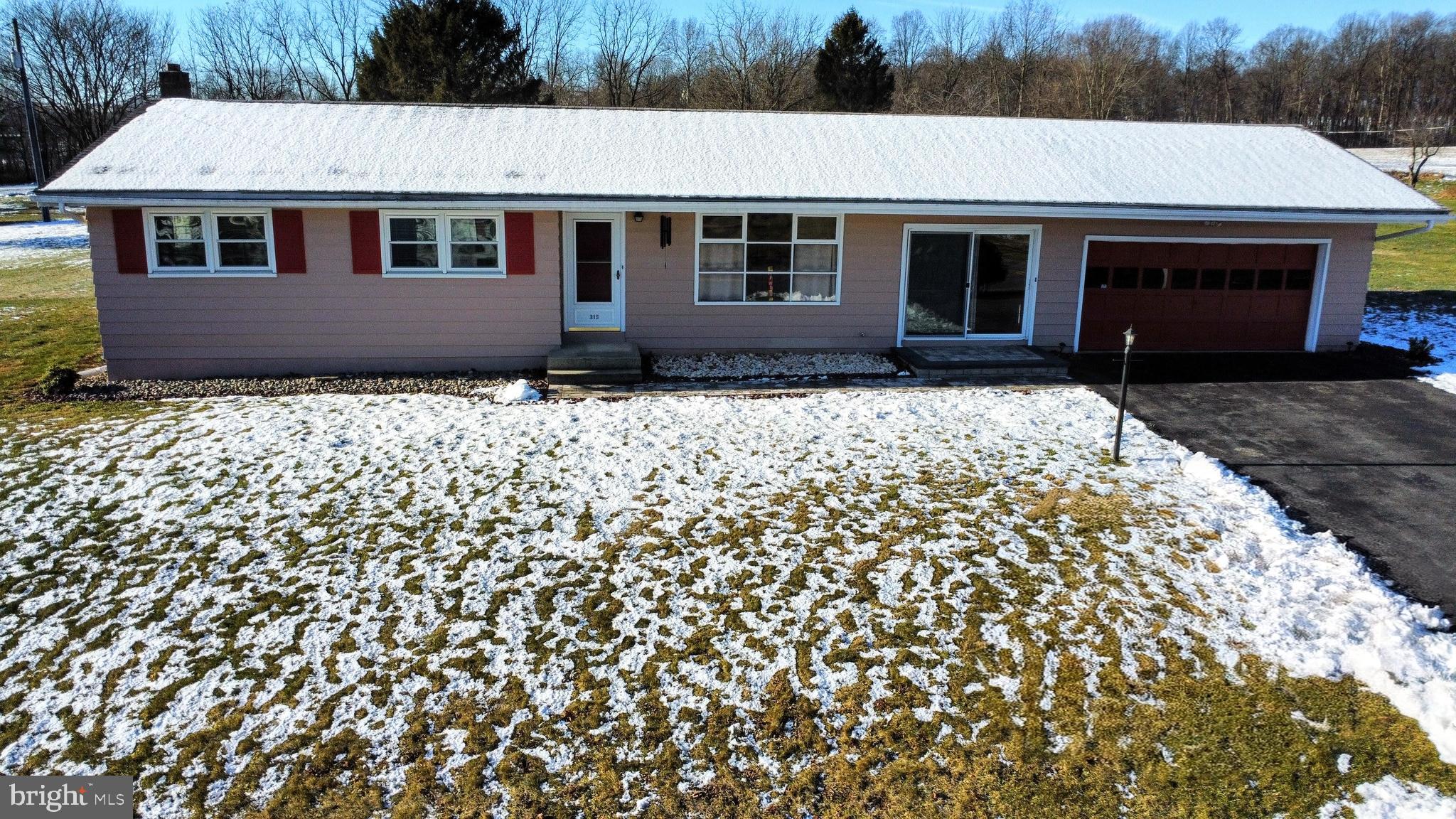 315 Long Lane Road Walnutport, PA 18088 - Photo 3 of 31 a front view of a house with a garden