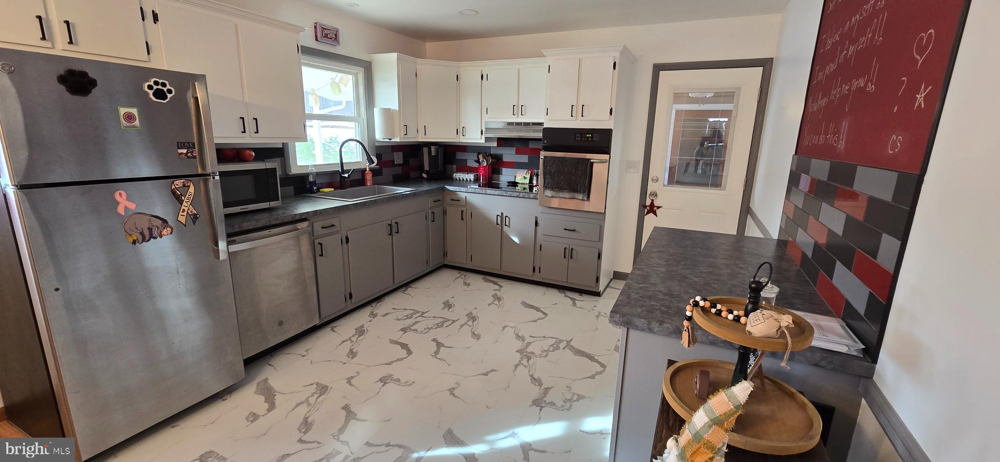 315 Long Lane Road Walnutport, PA 18088 - Photo 7 of 31 a kitchen with a refrigerator and cabinets