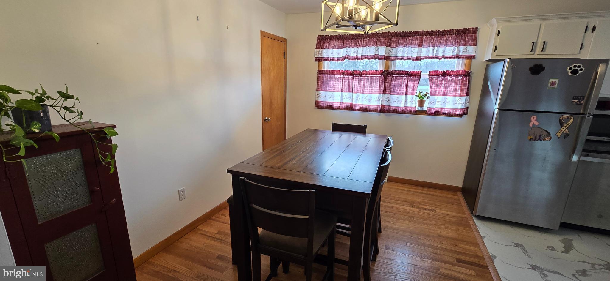 315 Long Lane Road Walnutport, PA 18088 - Photo 9 of 31 a kitchen with a refrigerator and wooden floor