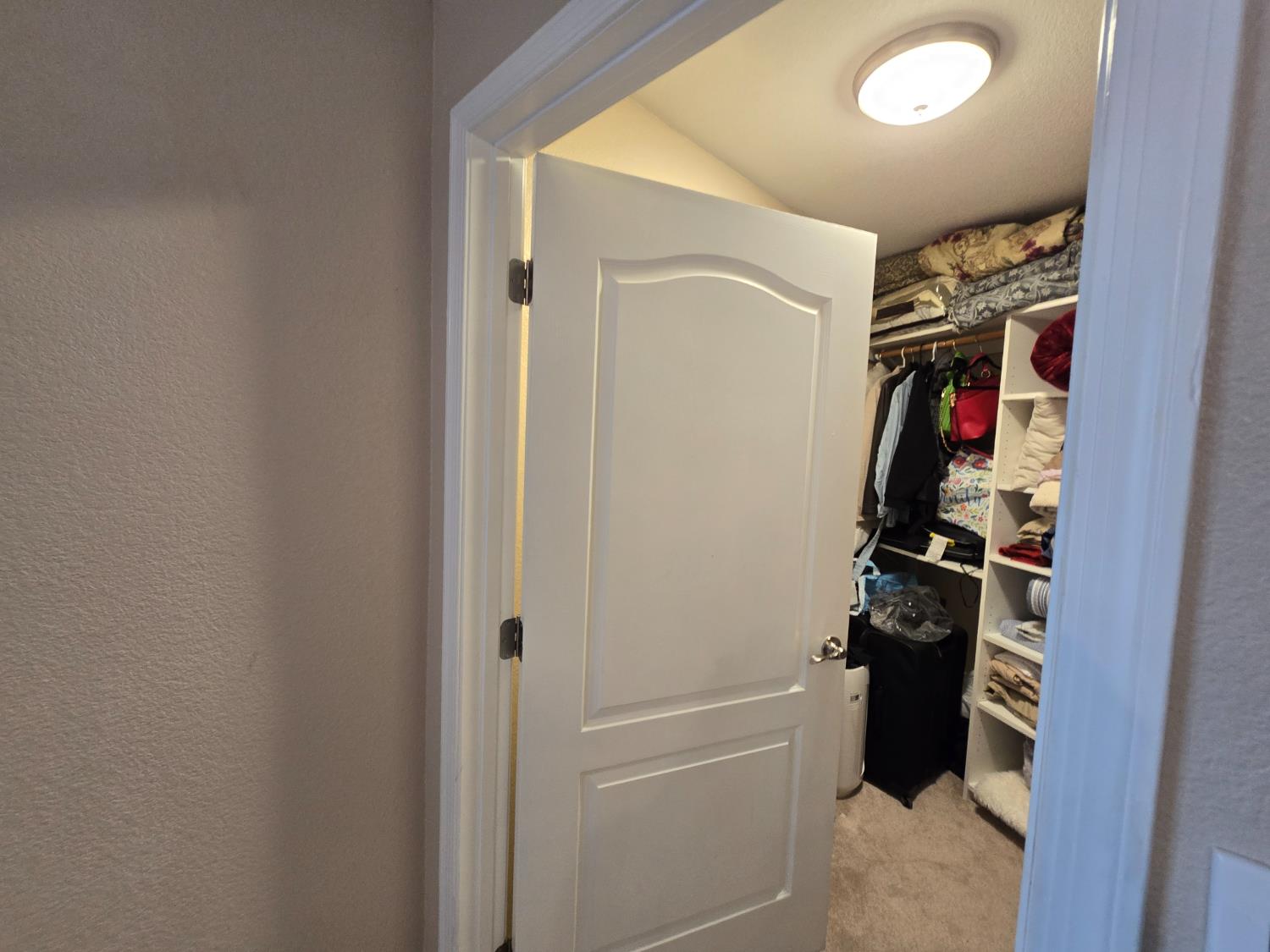 5995 West Brooks Road Merced, CA 95341 - Photo 18 of 23 a view of walk in closet with clothes