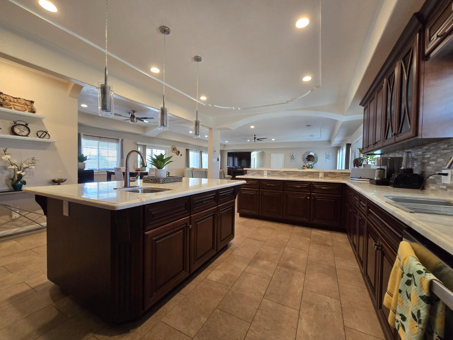 5995 West Brooks Road Merced, CA 95341 - Photo 7 of 23 a kitchen with stainless steel appliances granite countertop a sink counter space cabinets and a large window